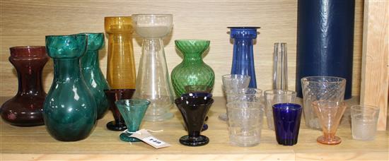 Seven Edwardian coloured glass hyacinth vases, a slender specimen vase and a thirteen other assorted glasses